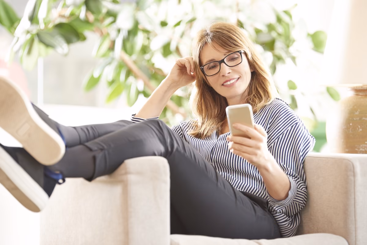 Woman in 60's looking at phone