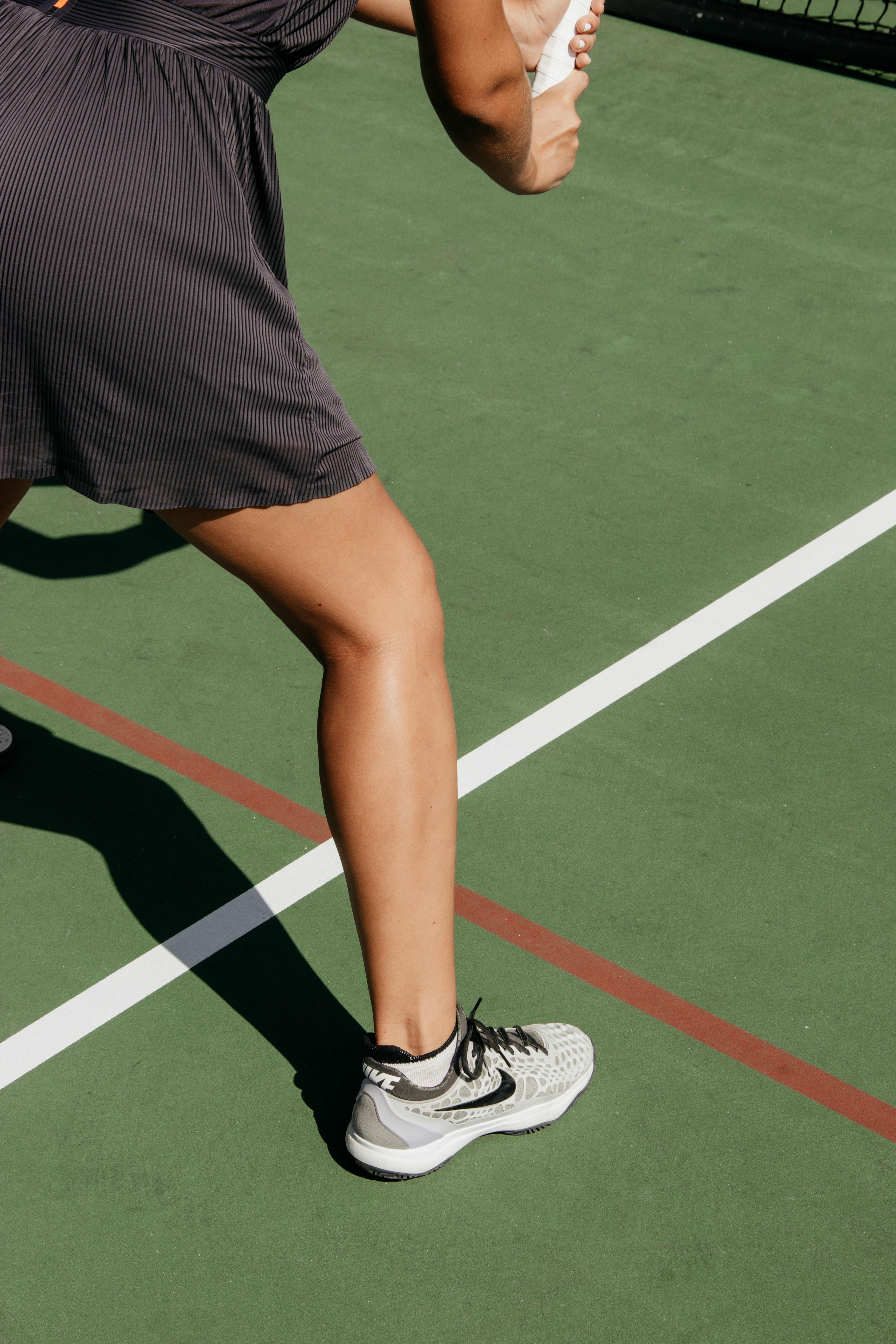 Person on tennis court stock image