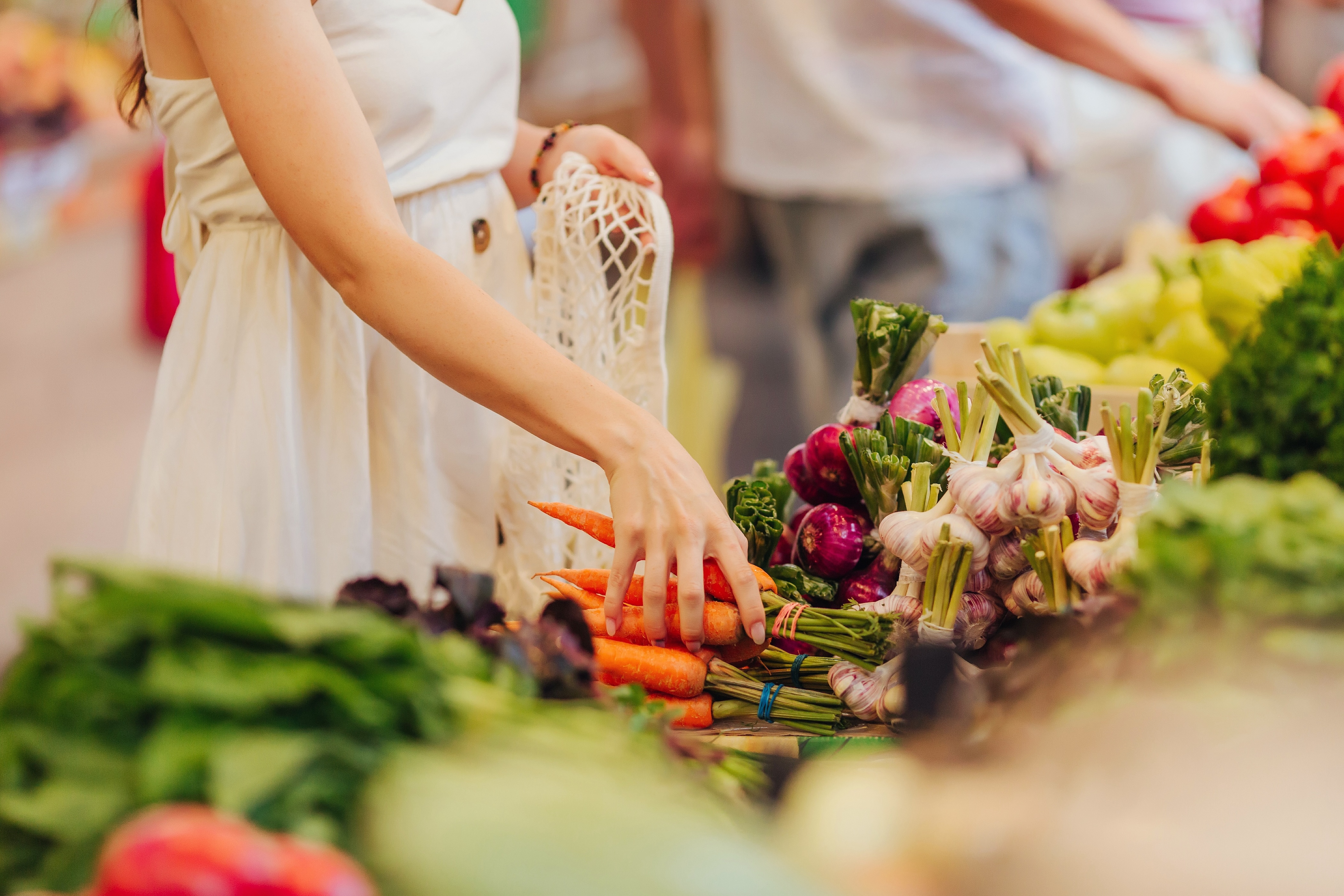 Person shopping at farmers market stock image