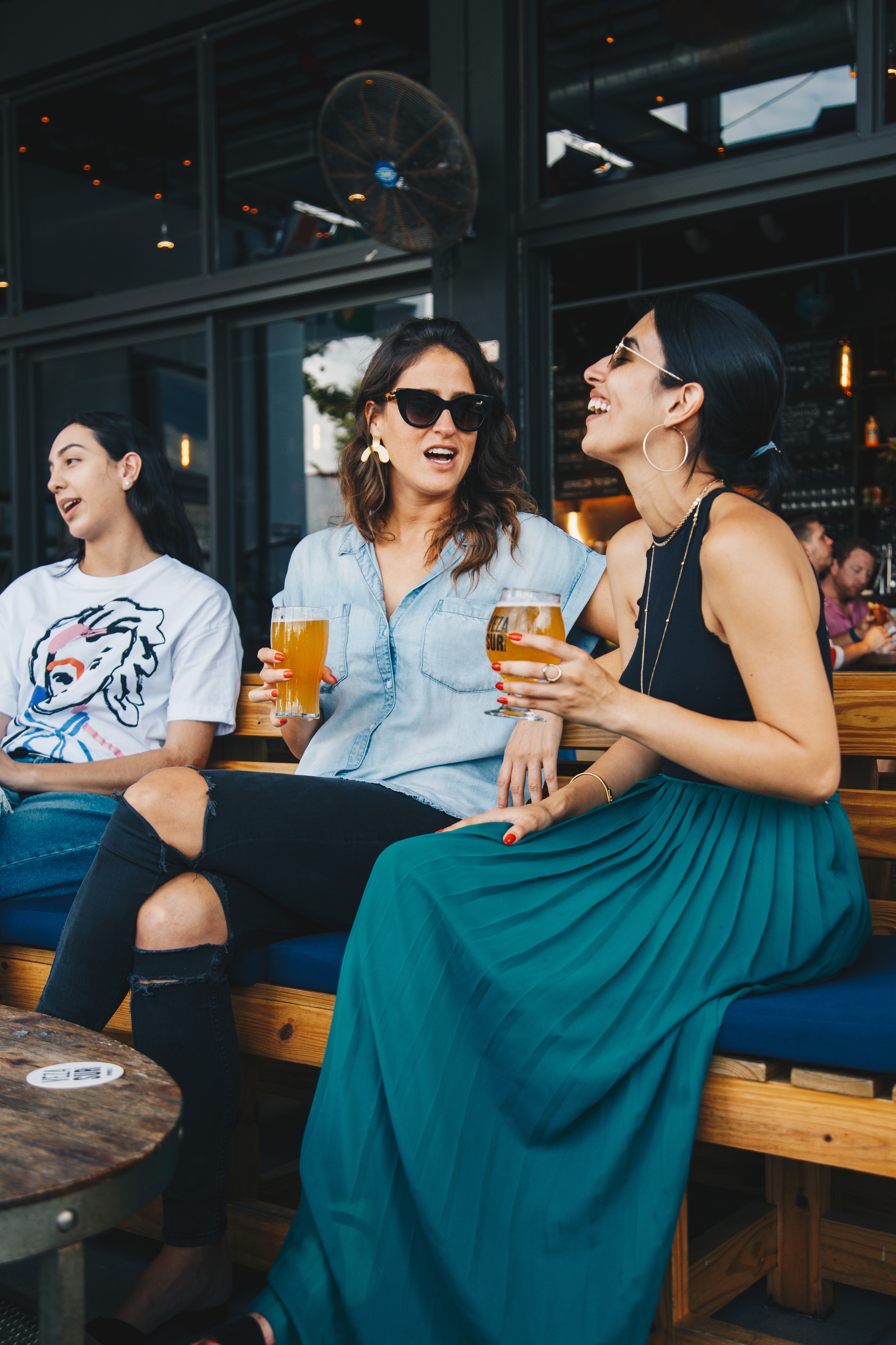Women laughing at restaurant stock image