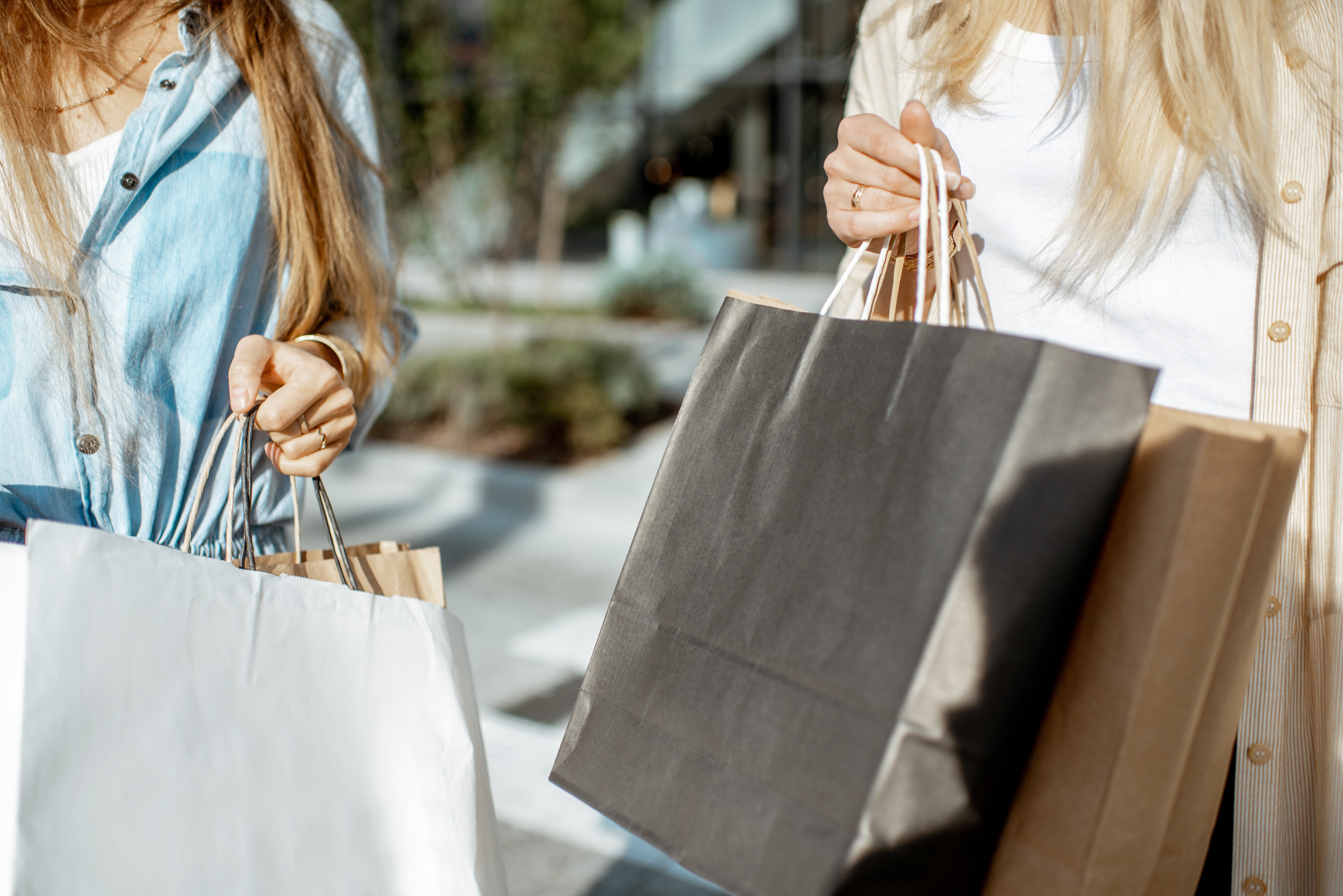People carrying shopping bags stock image