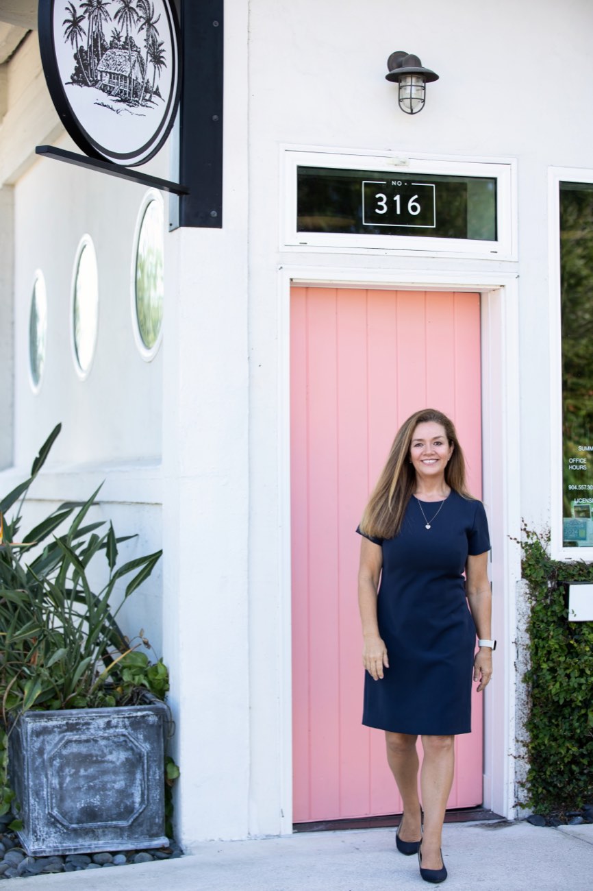 Angie outside the Summer House Realty office at 316 Ash Street, Fernandina Beach