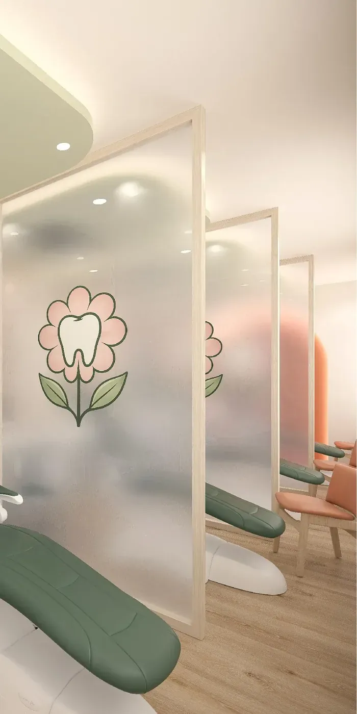 Frosted glass dividers with a tooth-flower design between treatment chairs