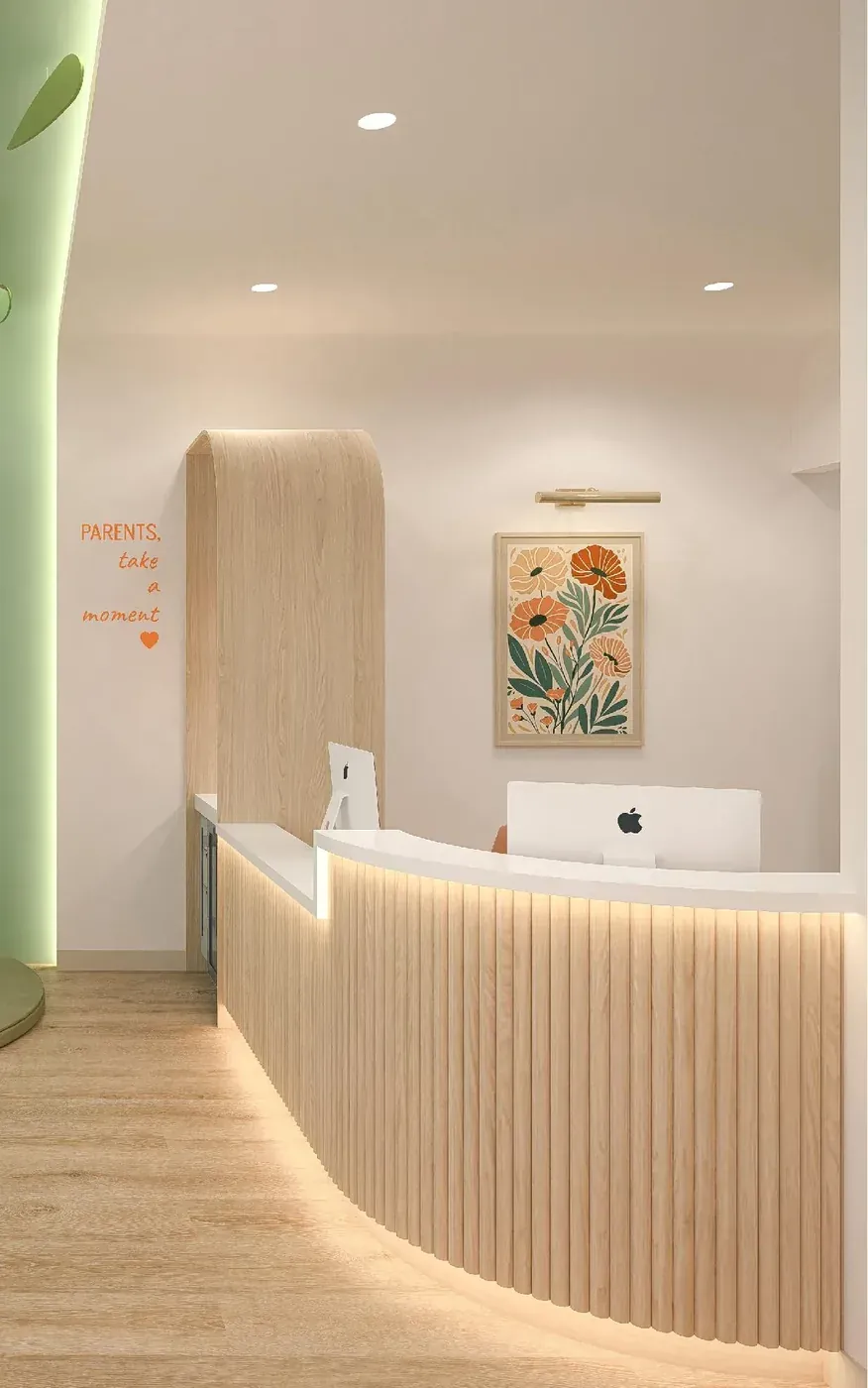 Curved wood-slat reception desk with floral artwork