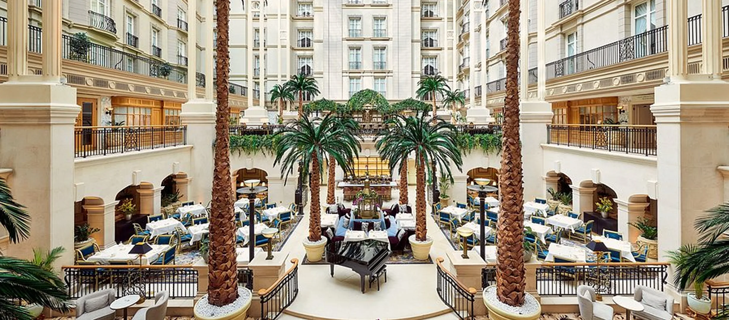 Grand hotel atrium with palm trees