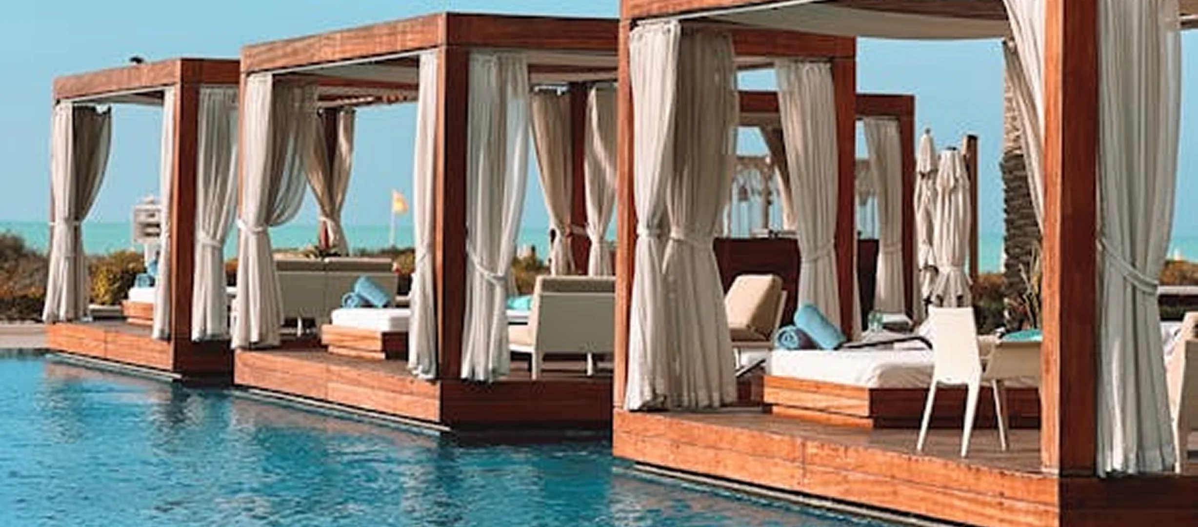 Poolside cabanas at a seaside resort