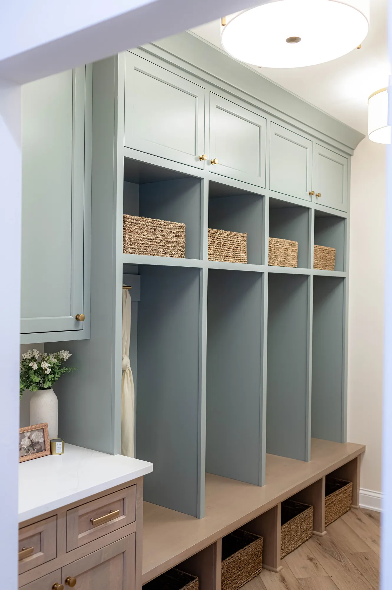 Painted mudroom lockers with a bench and cubbies