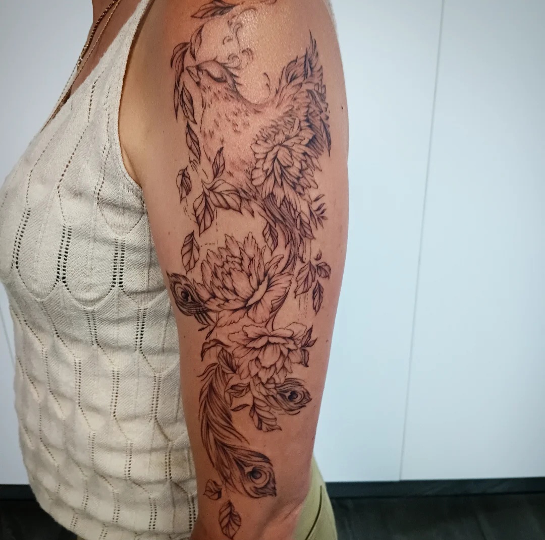 Illustrative arm tattoo sleeve by Ramona at Lady Ink