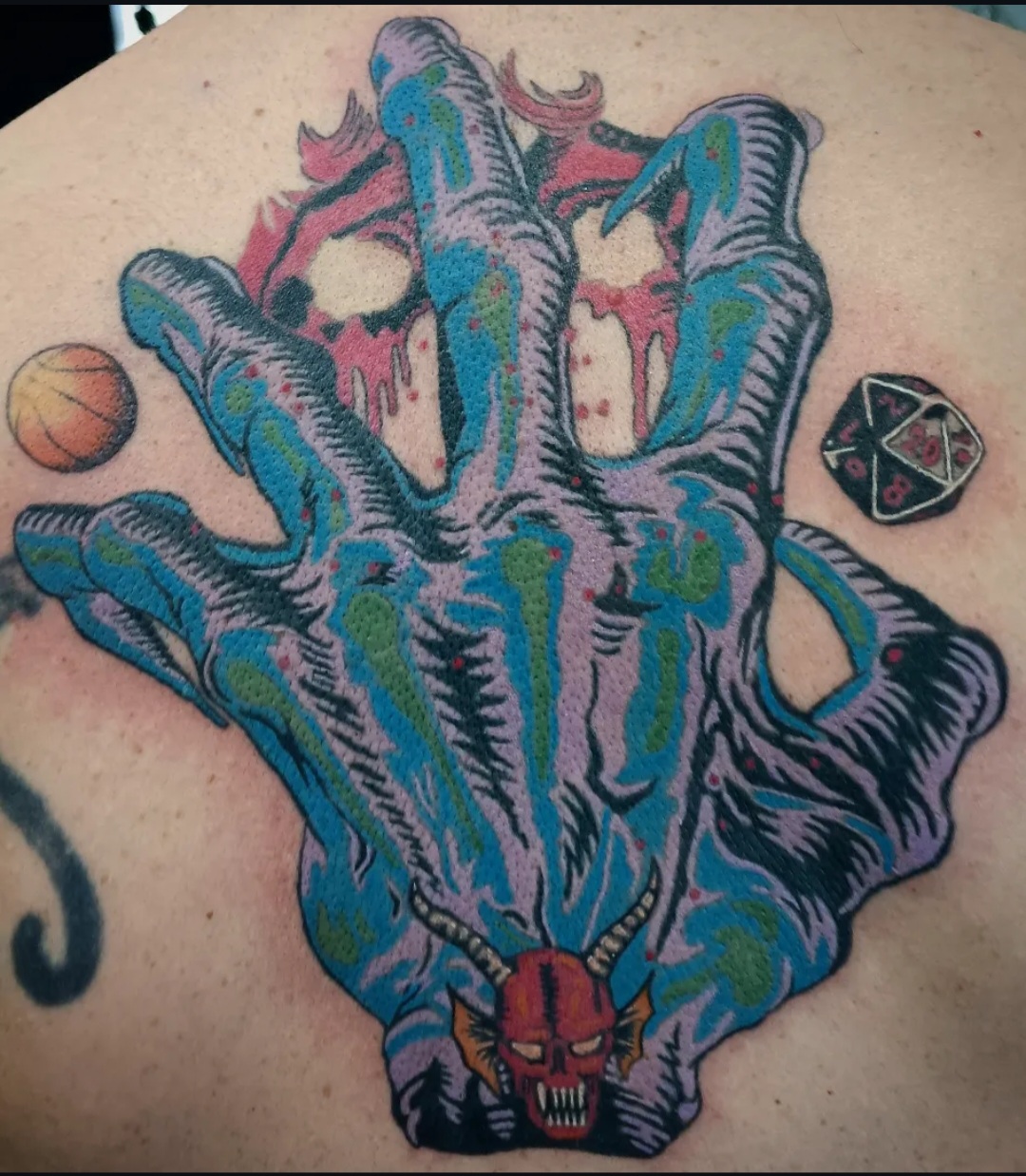 Colourful skeletal hand tattoo by Ramona at Lady Ink