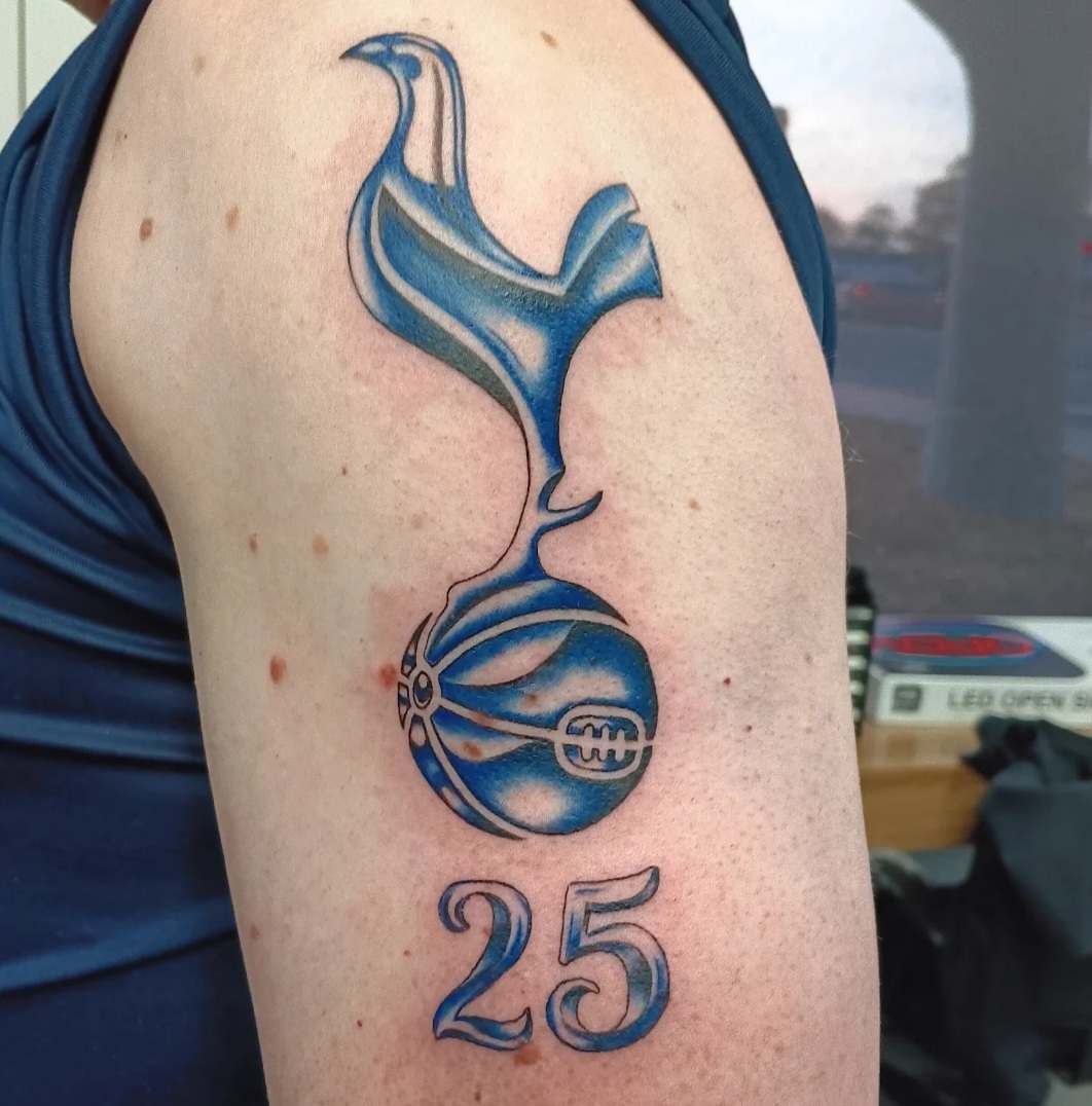Blue football emblem tattoo by Ramona at Lady Ink