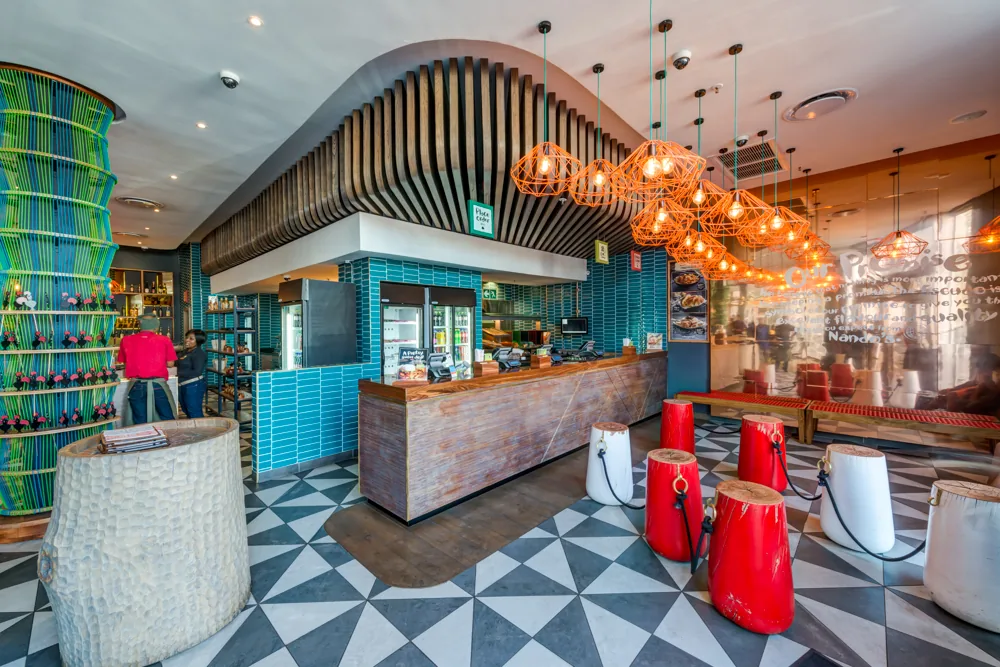 Nandos Maponya interior designed by Design Partnership.