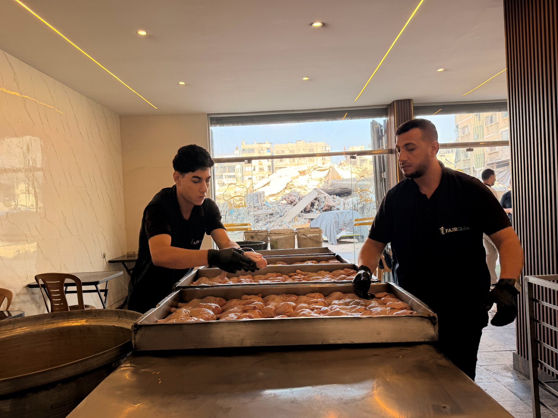FAJR Global staff preparing meals for displaced families