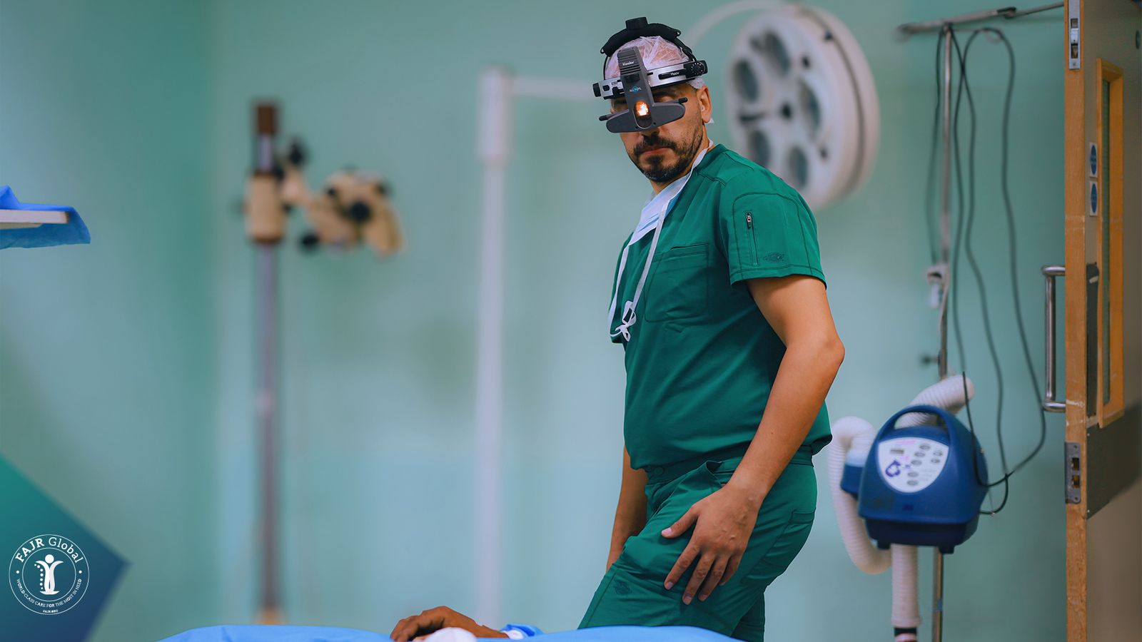 A FAJR surgeon with a headlamp in an operating room