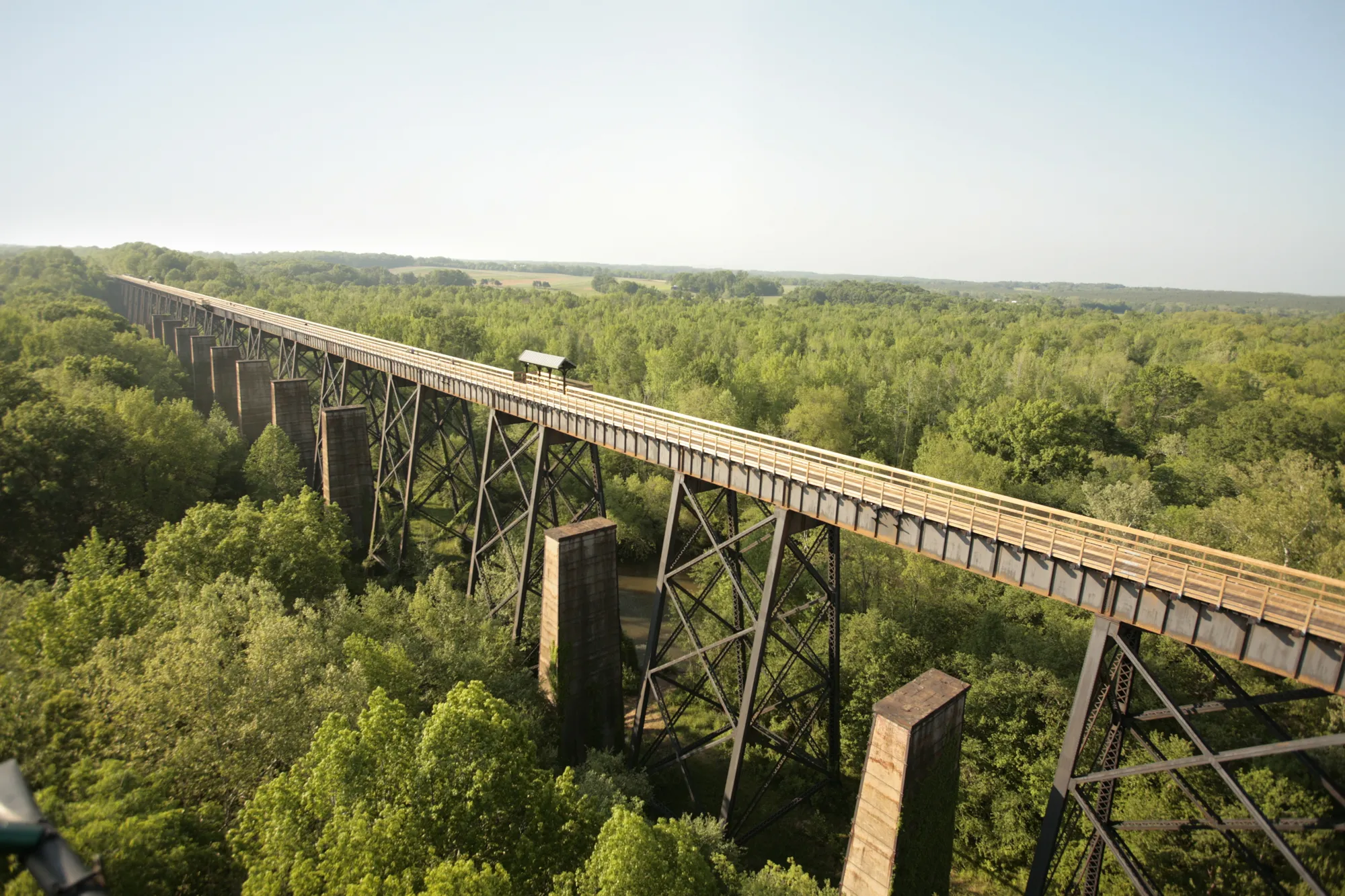 High Bridge, the historic railroad trestle over the Appomattox River near Farmville, Virginia, surrounded by green treetops