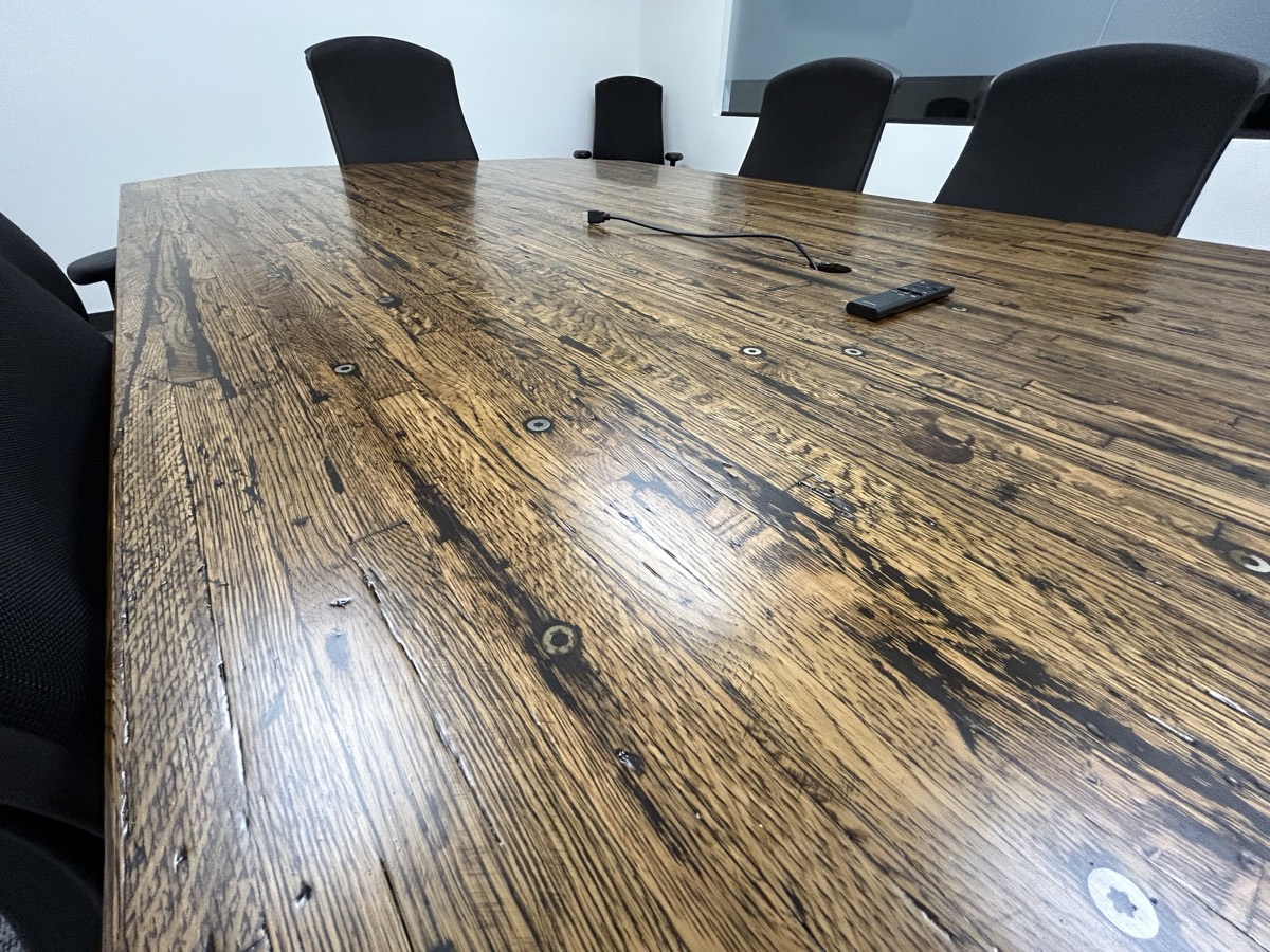 Boardroom table with a reclaimed hardwood top.