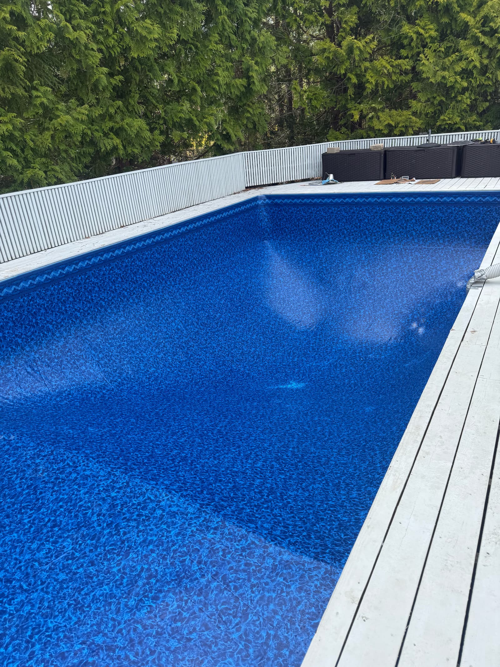 Pool renovation in progress with new bright blue liner and built-in steps on Long Island, NY near Westhampton.