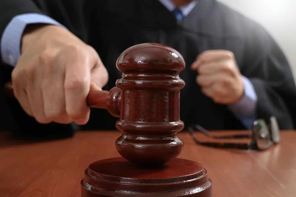 Judge striking gavel in courtroom