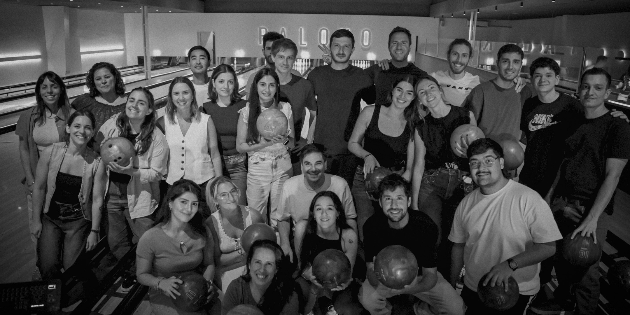 The Ryz Labs team gathered in a courtyard after an evening event