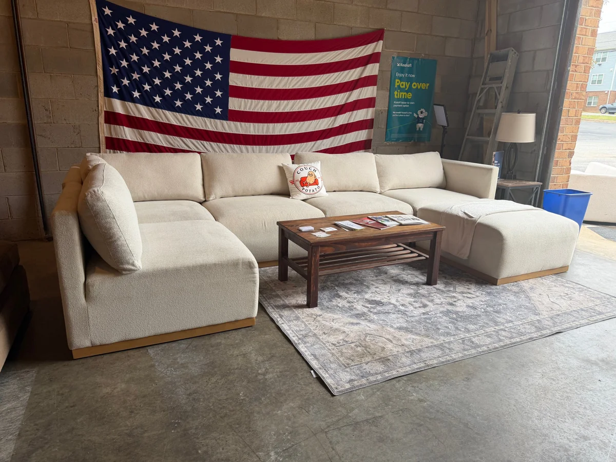 Cream modular sectional sofa with ottoman for sale at Couch Potato RVA in Richmond, VA