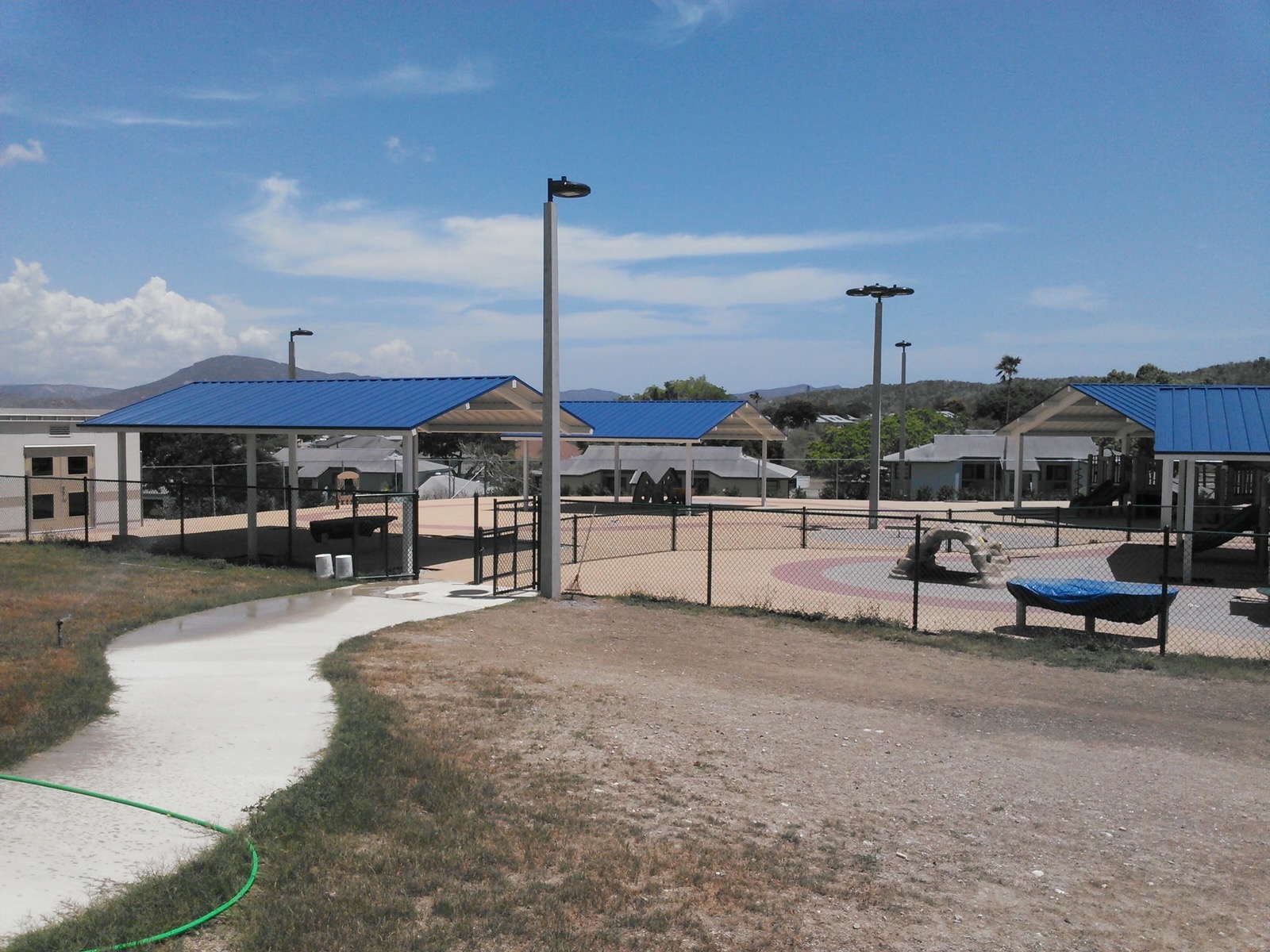 Shade shelters over a completed play area at Guantanamo Bay