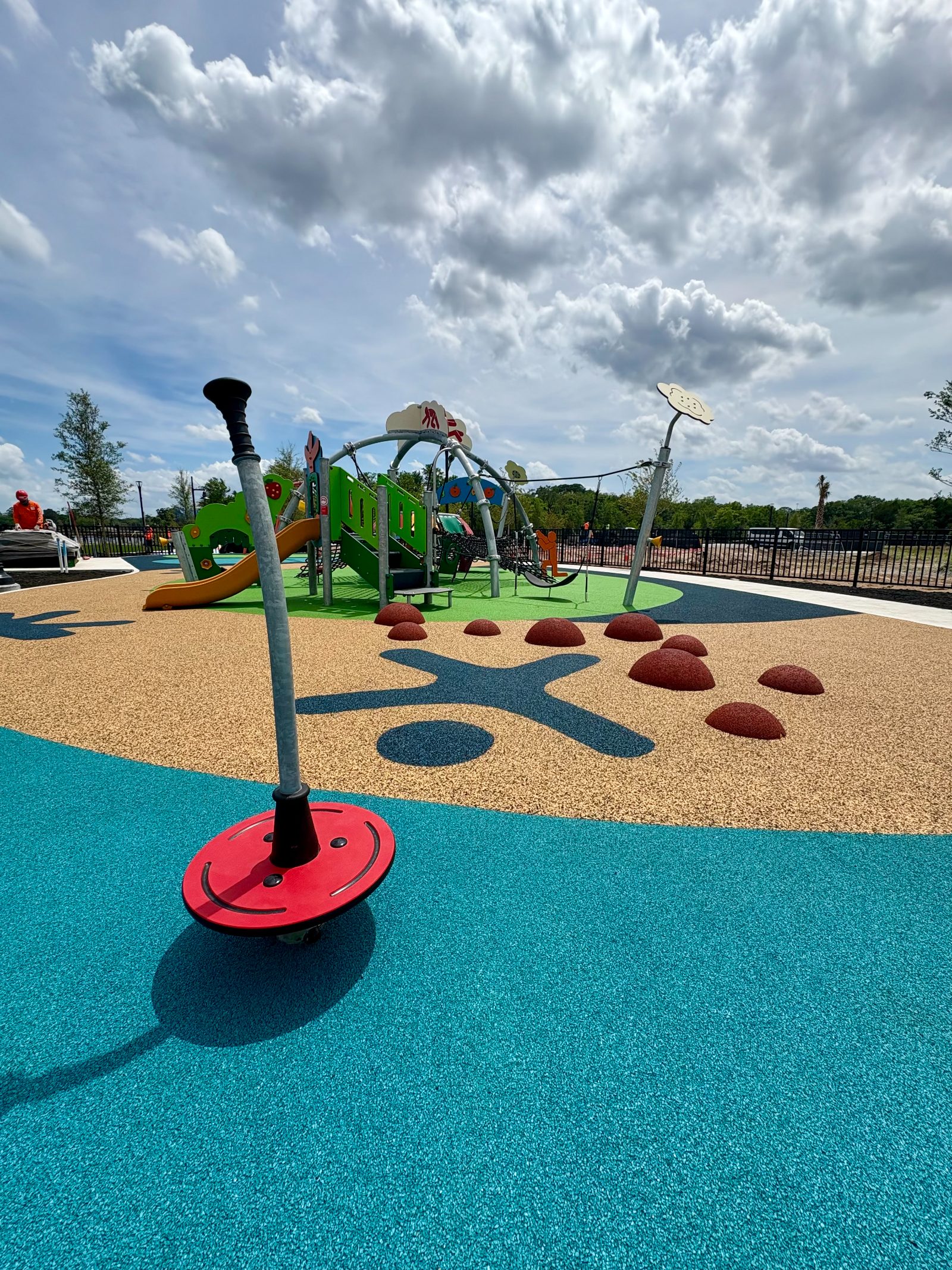 A spinner on poured-in-place surfacing
