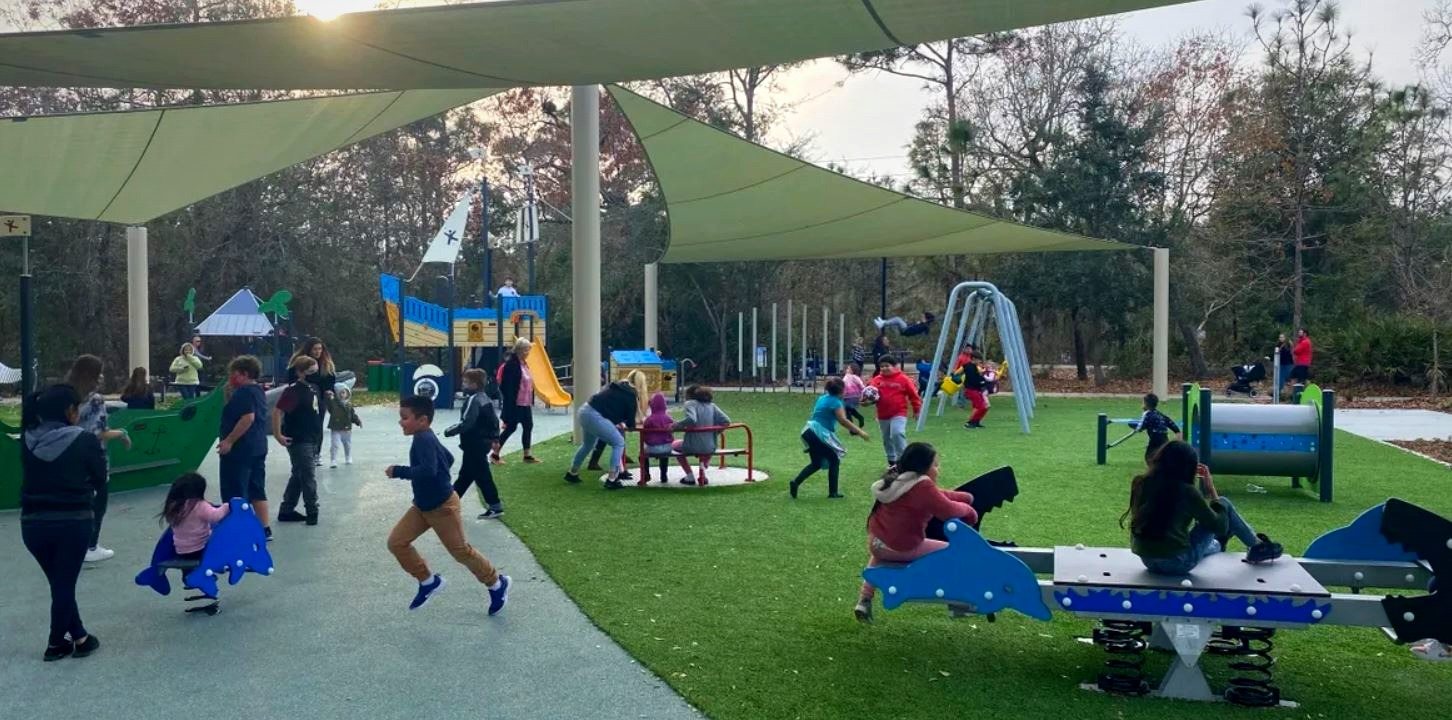 Families and children enjoying an IGS-installed community park