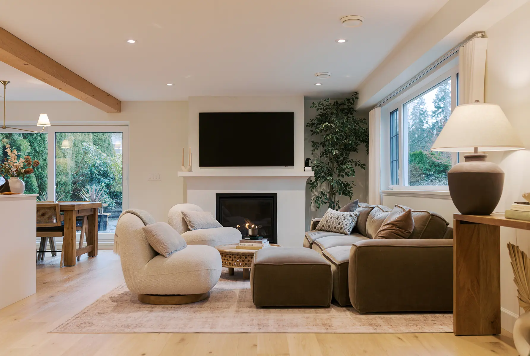 Living room with fireplace, exposed beam and garden views, Pemberton Heights renovation
