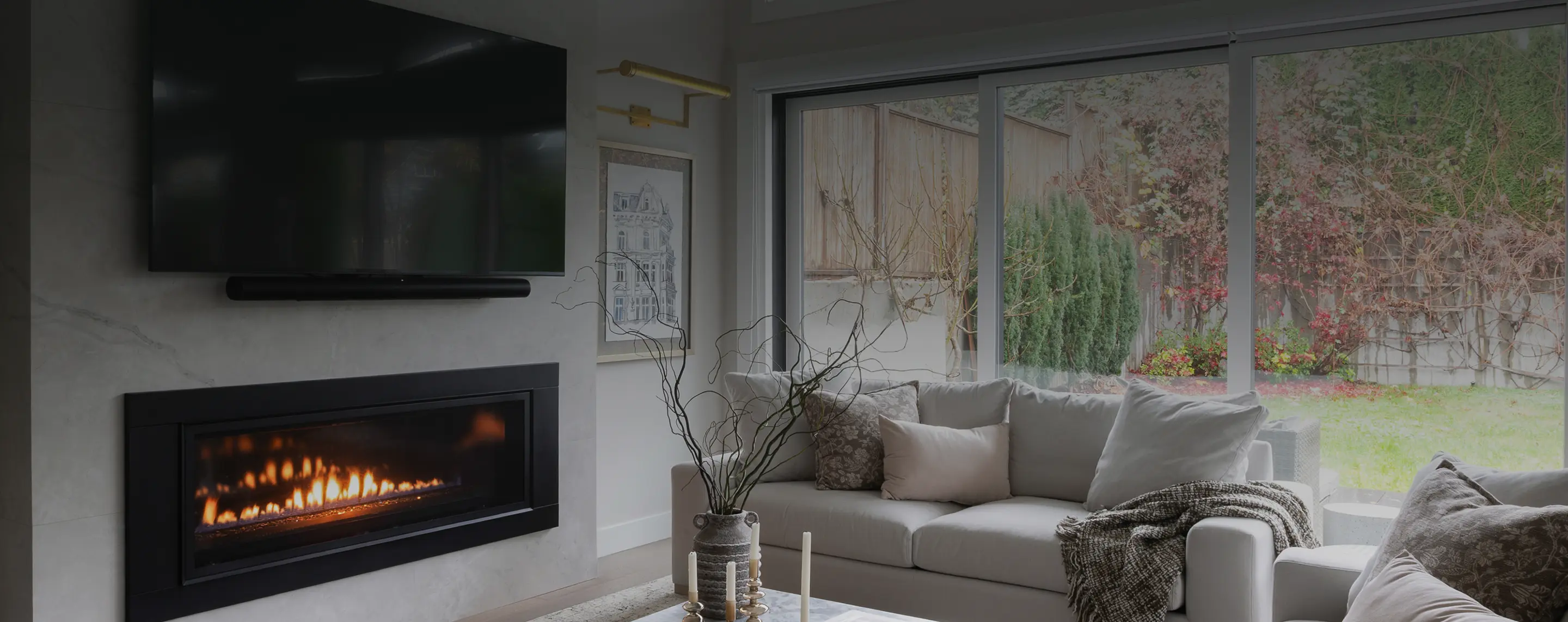 Fireplace wall and living room with garden views, Baird Avenue main floor renovation in Lynn Valley
