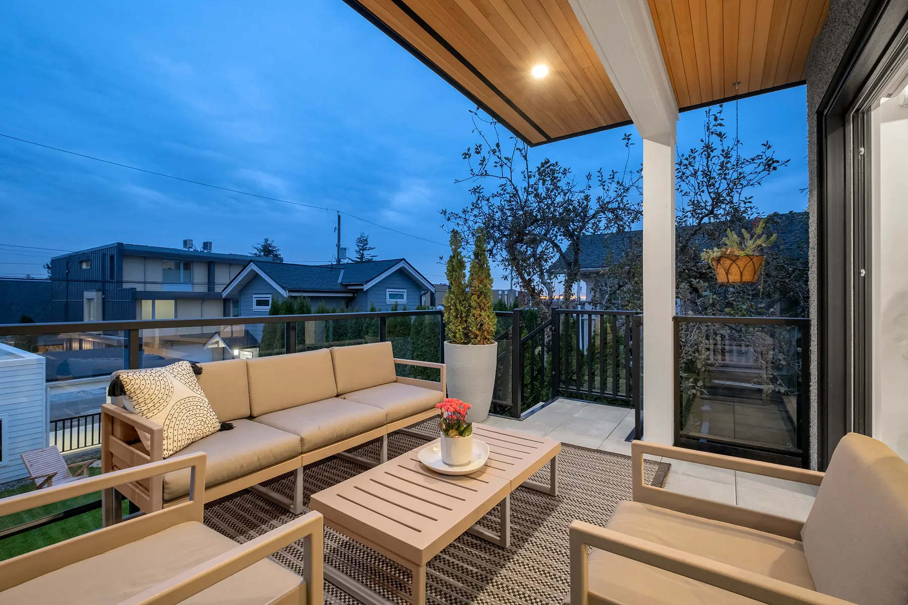 Covered balcony with outdoor sofa and a wood-panelled ceiling, 4th Street duplex