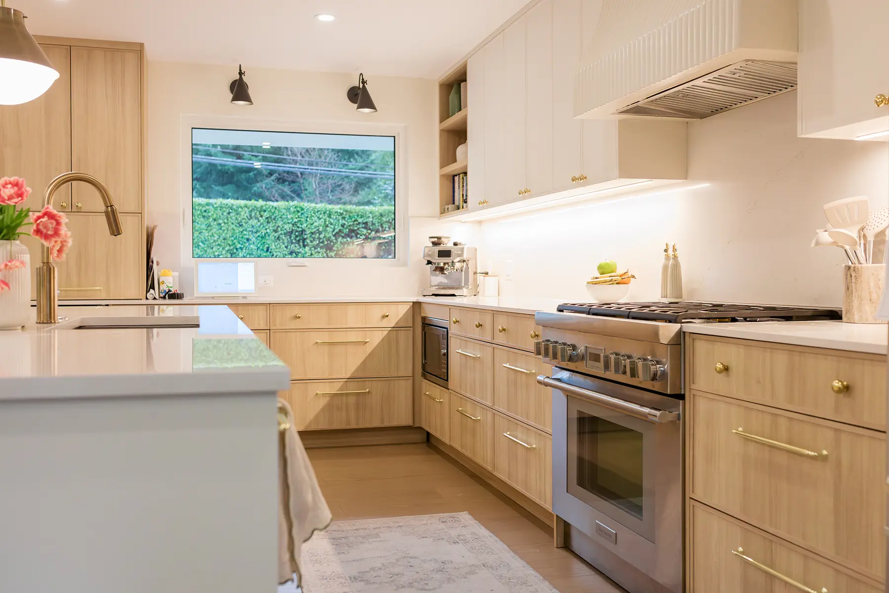Kitchen with light oak cabinetry, a brass tap and a window over the sink, Pemberton Heights renovation