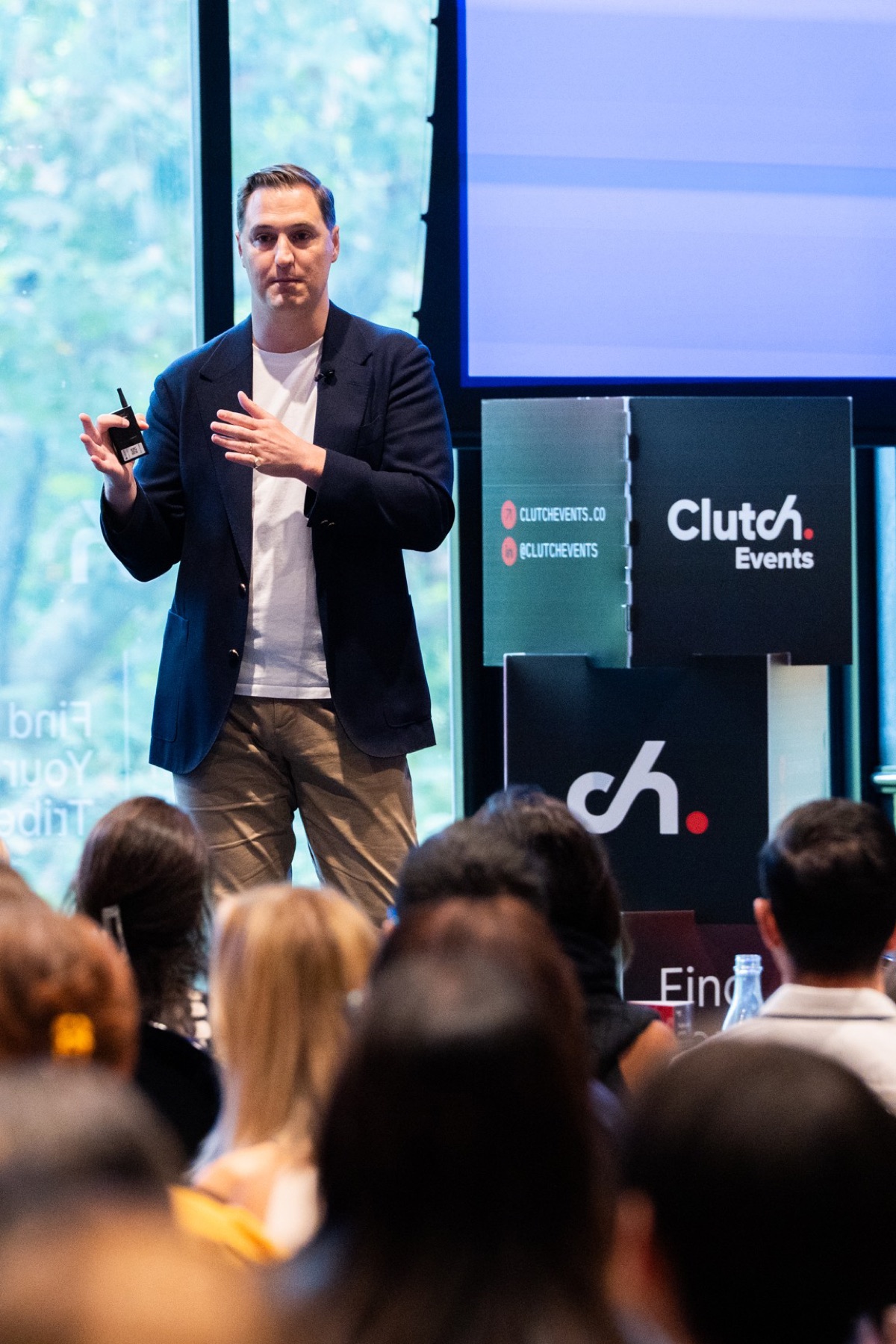 A marketing technology speaker presenting on stage at CustomerTech World