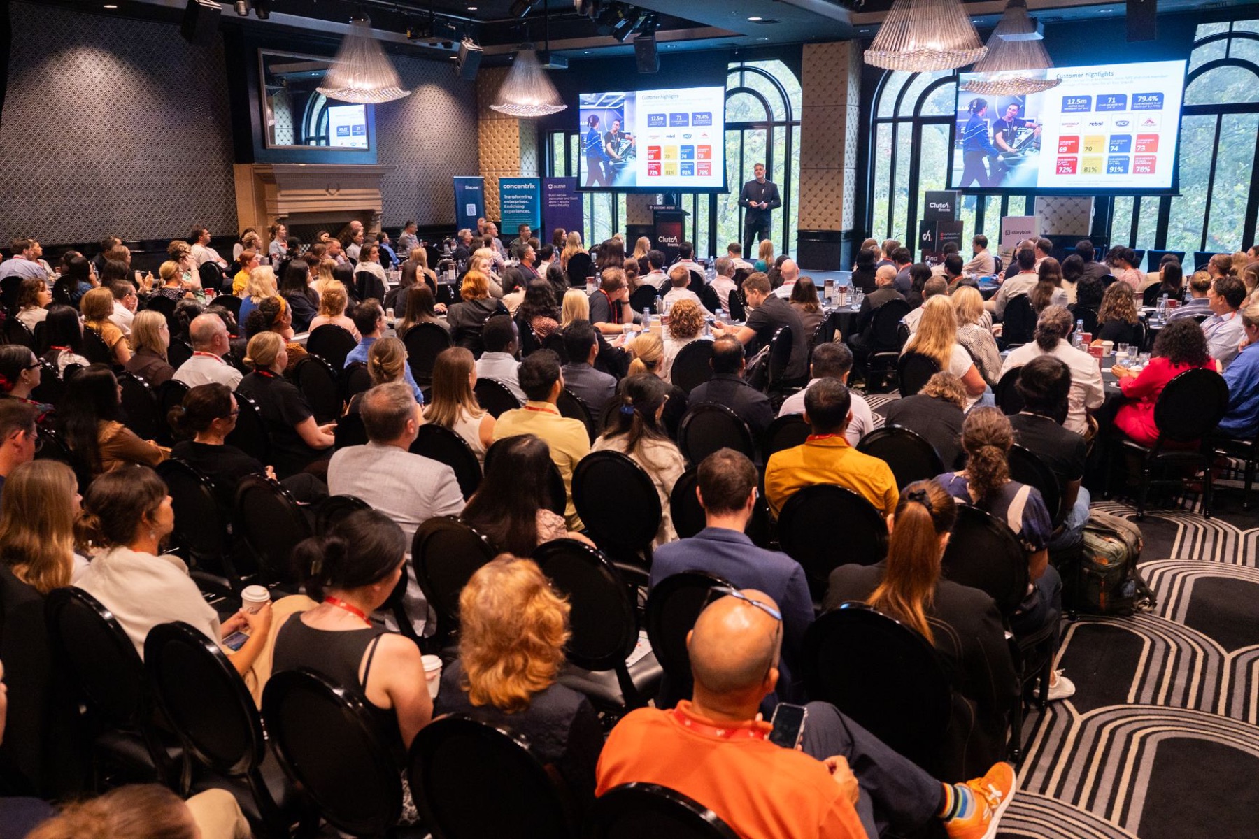 A full room of digital leaders watching a customer data keynote at CustomerTech World