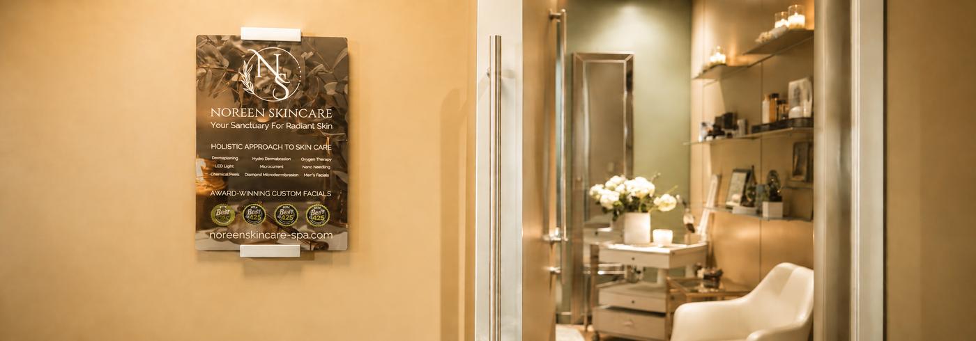 Noreen Skincare signage on the wall beside the treatment room entrance