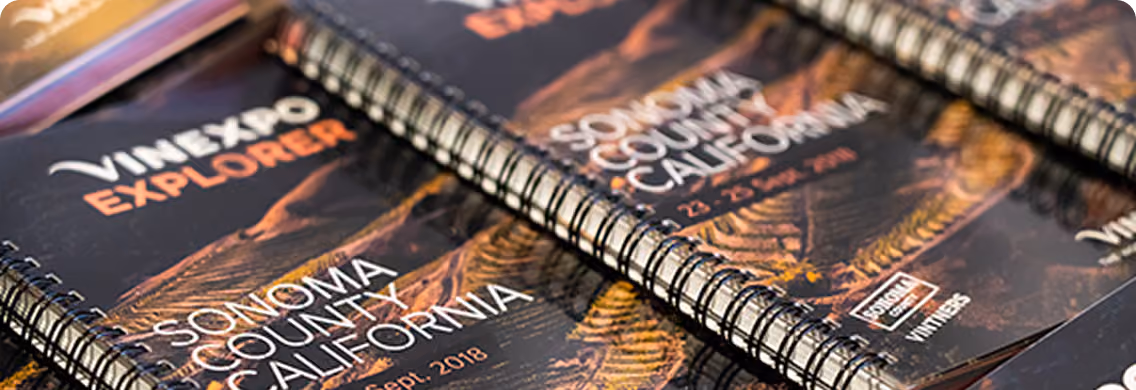 Spiral-bound guides titled 'Vinexpo Explorer' featuring Sonoma County, California, with visible date Sept. 2018, arranged side by side.