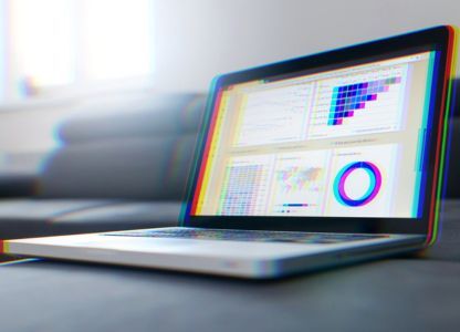 Laptop showing a marketing analytics dashboard with charts