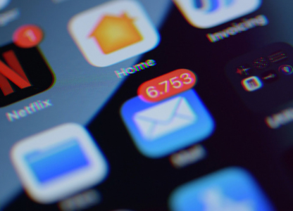 Phone home screen with an email app showing 6,753 unread messages