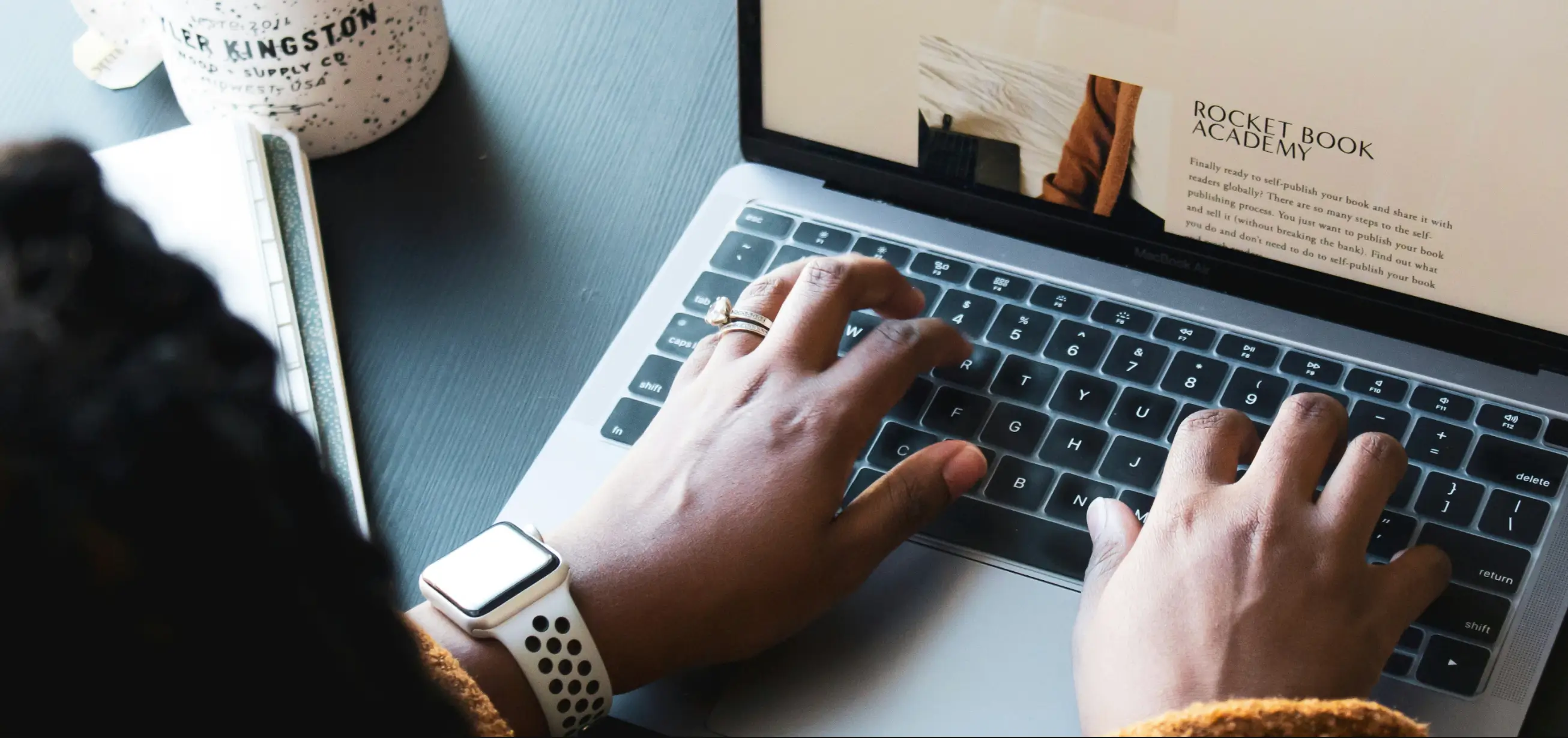 Person typing on a laptop showing an online shop product page