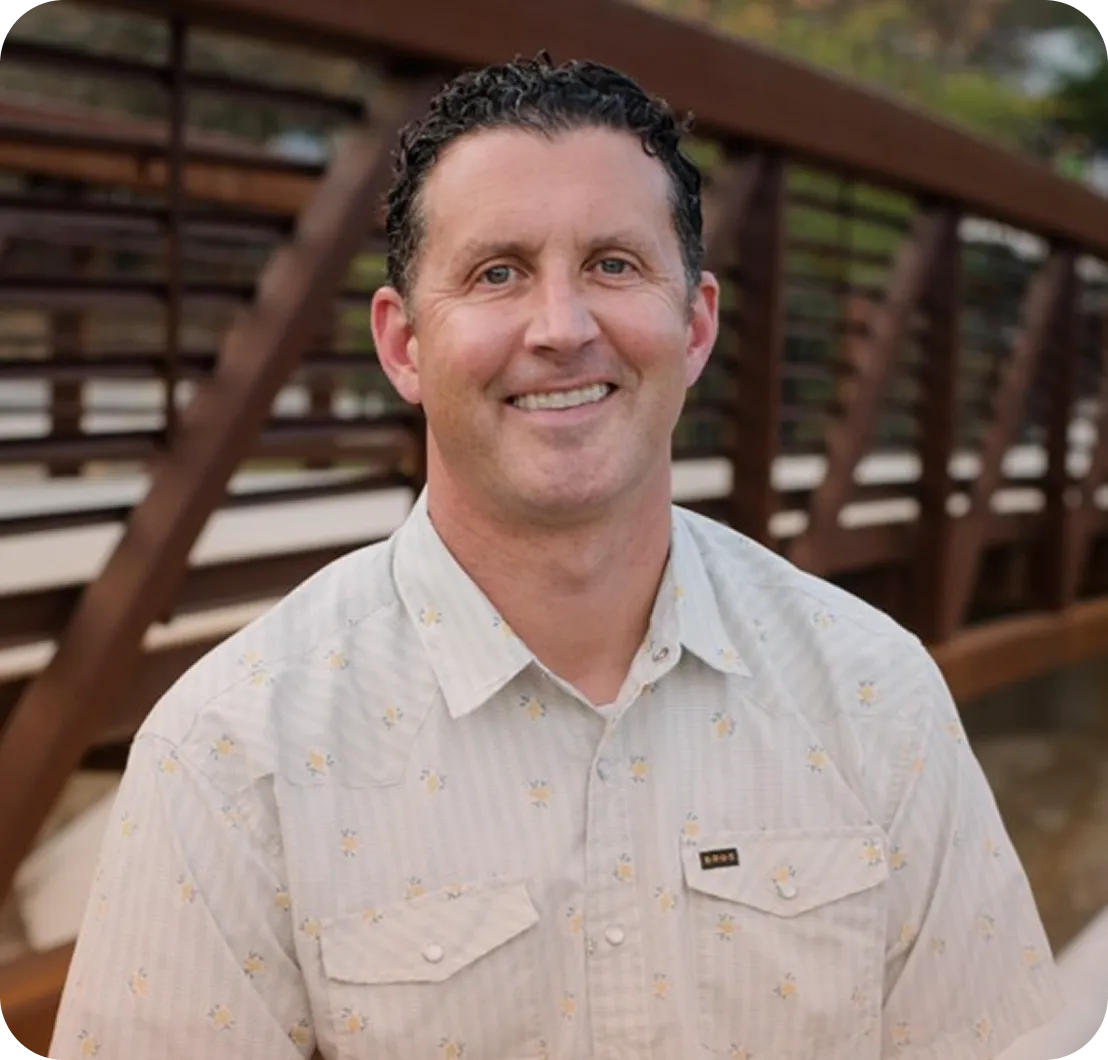 Dr. Bradley Pierson smiling outdoors.