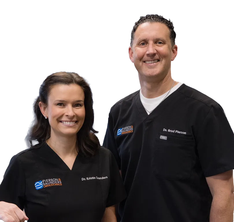 Dr. Bradley Pierson and a team member smiling together.