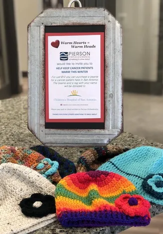 Handmade beanies donated to local cancer patients