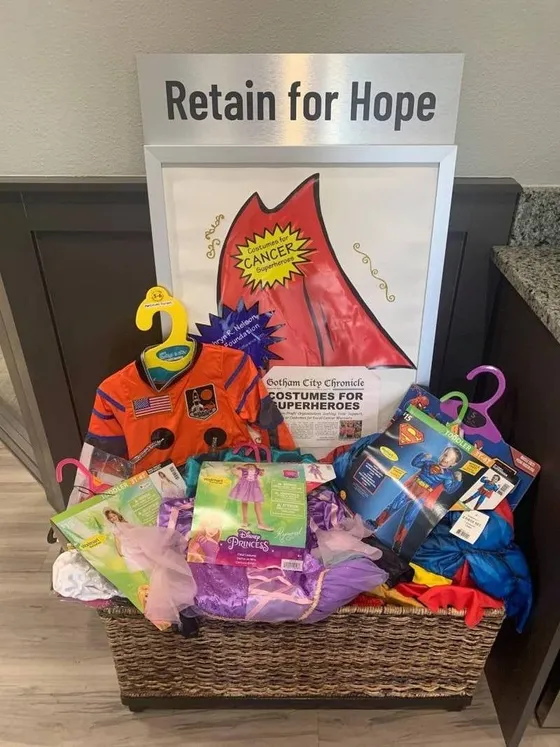 Basket of donated Halloween costumes for children undergoing cancer treatment