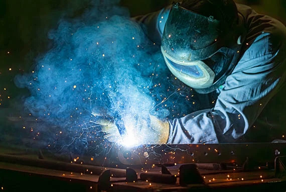Man welding metal frame