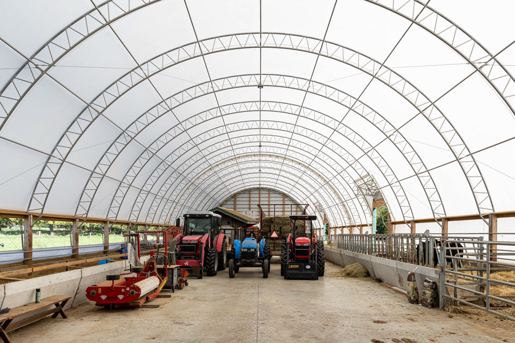 Thundura fabric structure used for tractor storage and an animal shelter