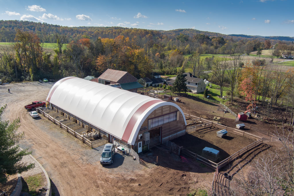 thundura fabric structure used for small animal shelter at a small farm.