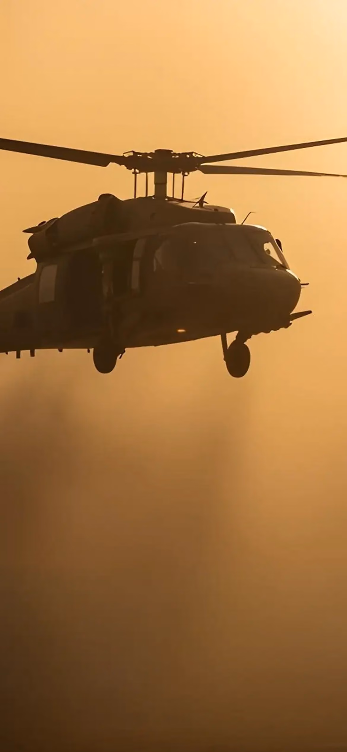 Helicopter flying in dusk