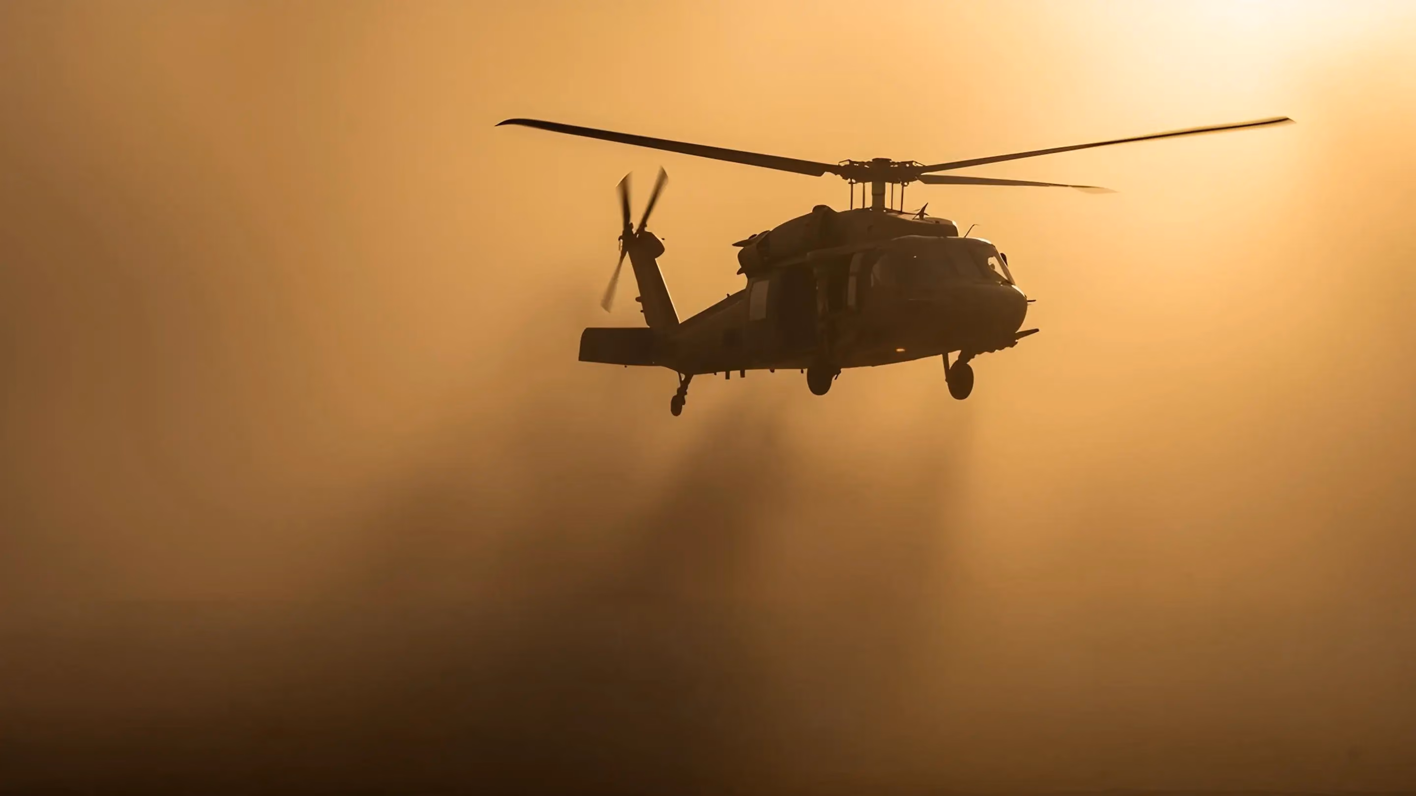 Helicopter flying in dusk