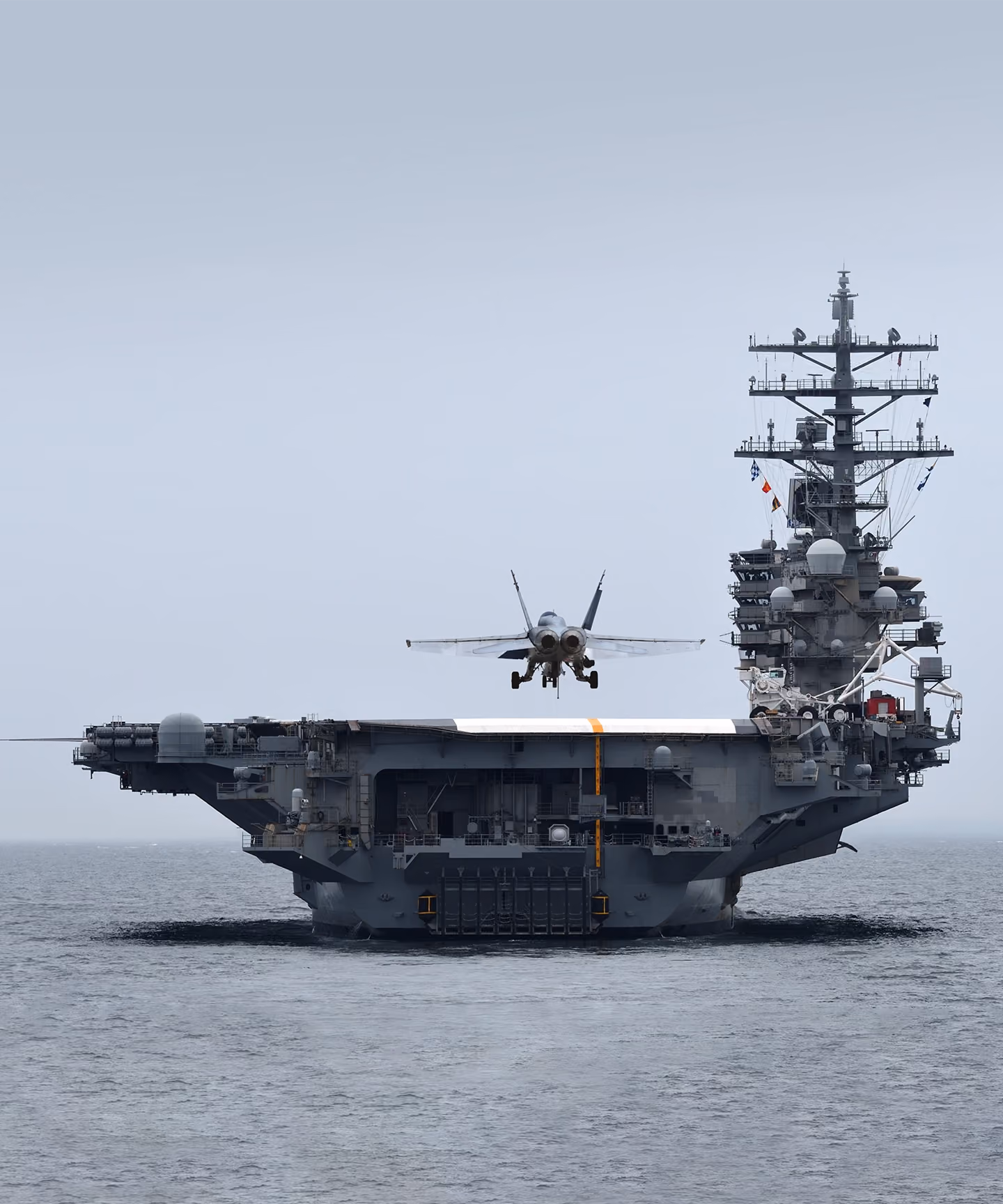 Plane taking off military ship