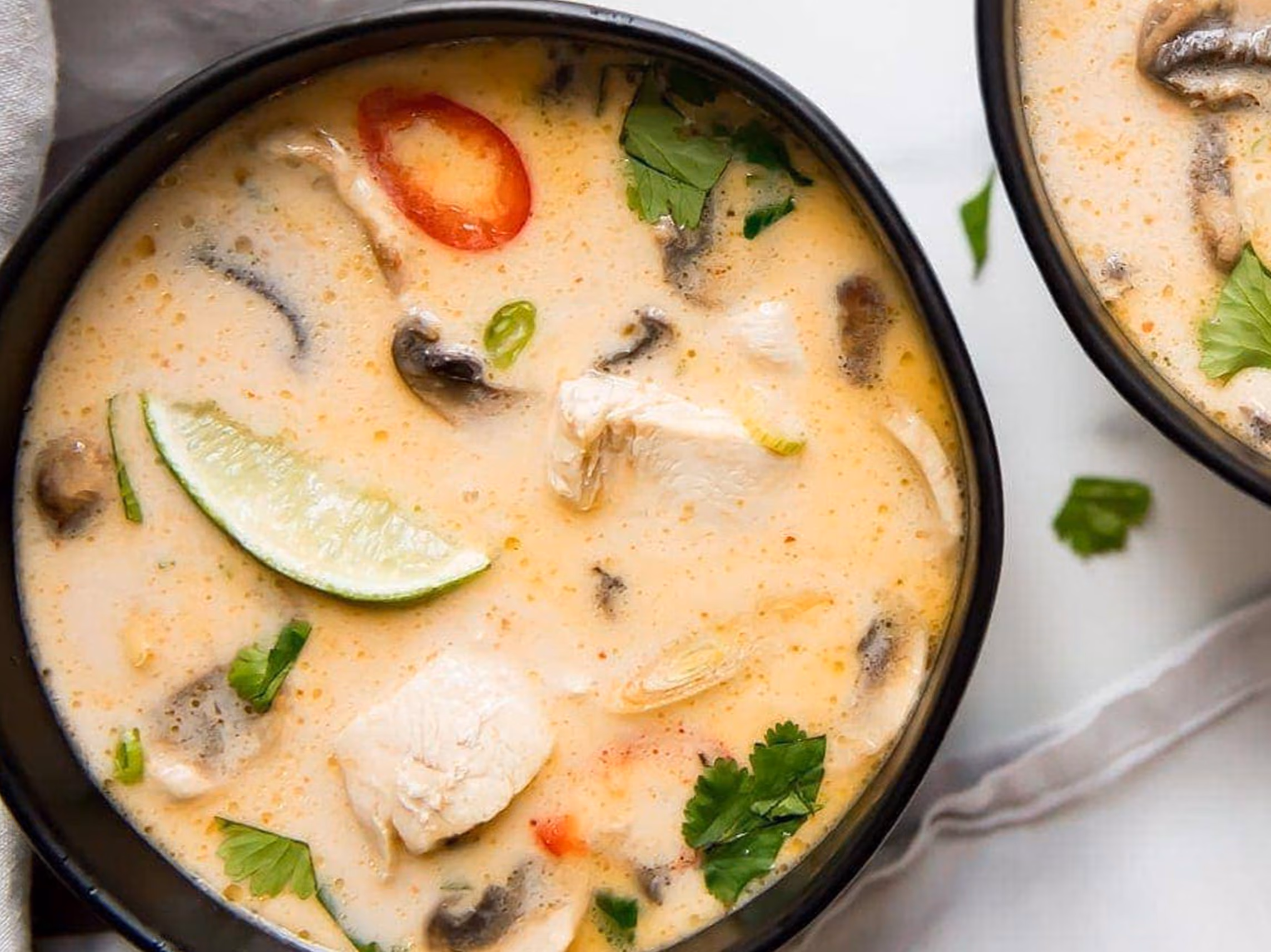 Coconut soup with chicken, mushrooms, galangal, lemongrass and kaffir lime leaves.