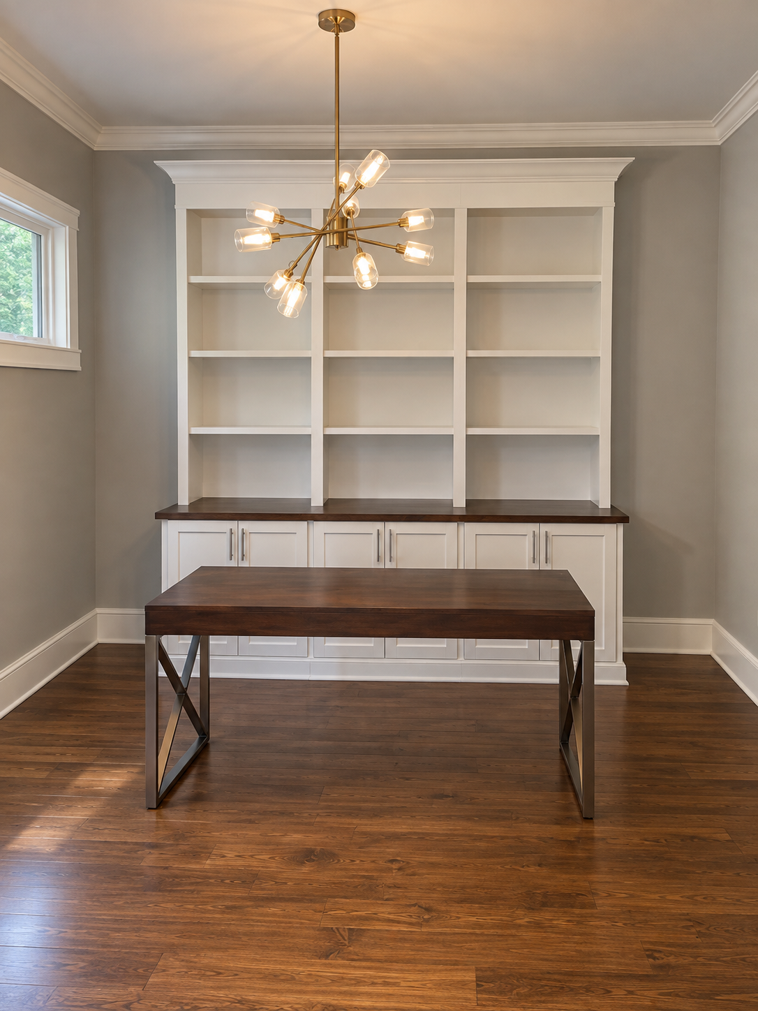 White library built-ins with open bookshelves, Shaker base cabinets and a walnut countertop