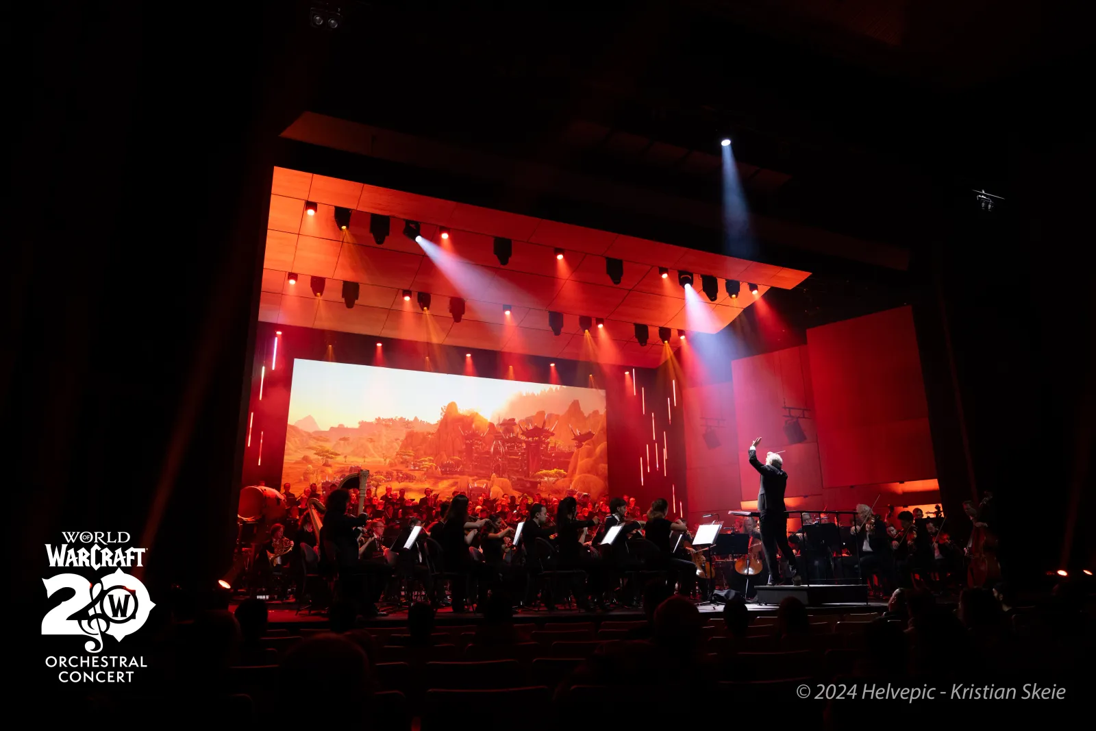 Orchestra on stage under red light